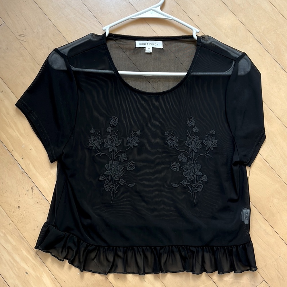 Short sleeve semi see-through tee-shirt great with playful bra. Never worn.